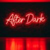 After Dark neon sign in red on grass wall