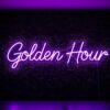 Golden Hour neon sign in purple on grass wall