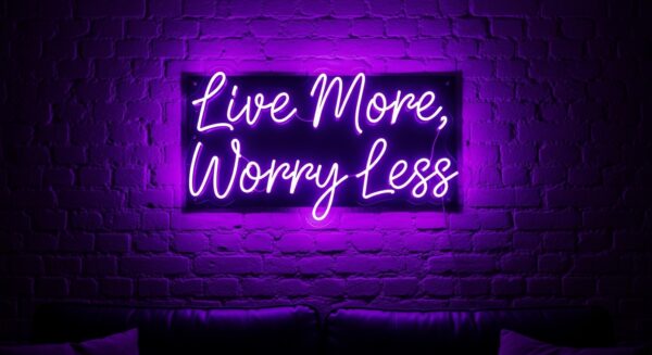 Live More, Worry Less neon sign in purple