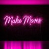 Make Moves neon sign in pink on grass wall